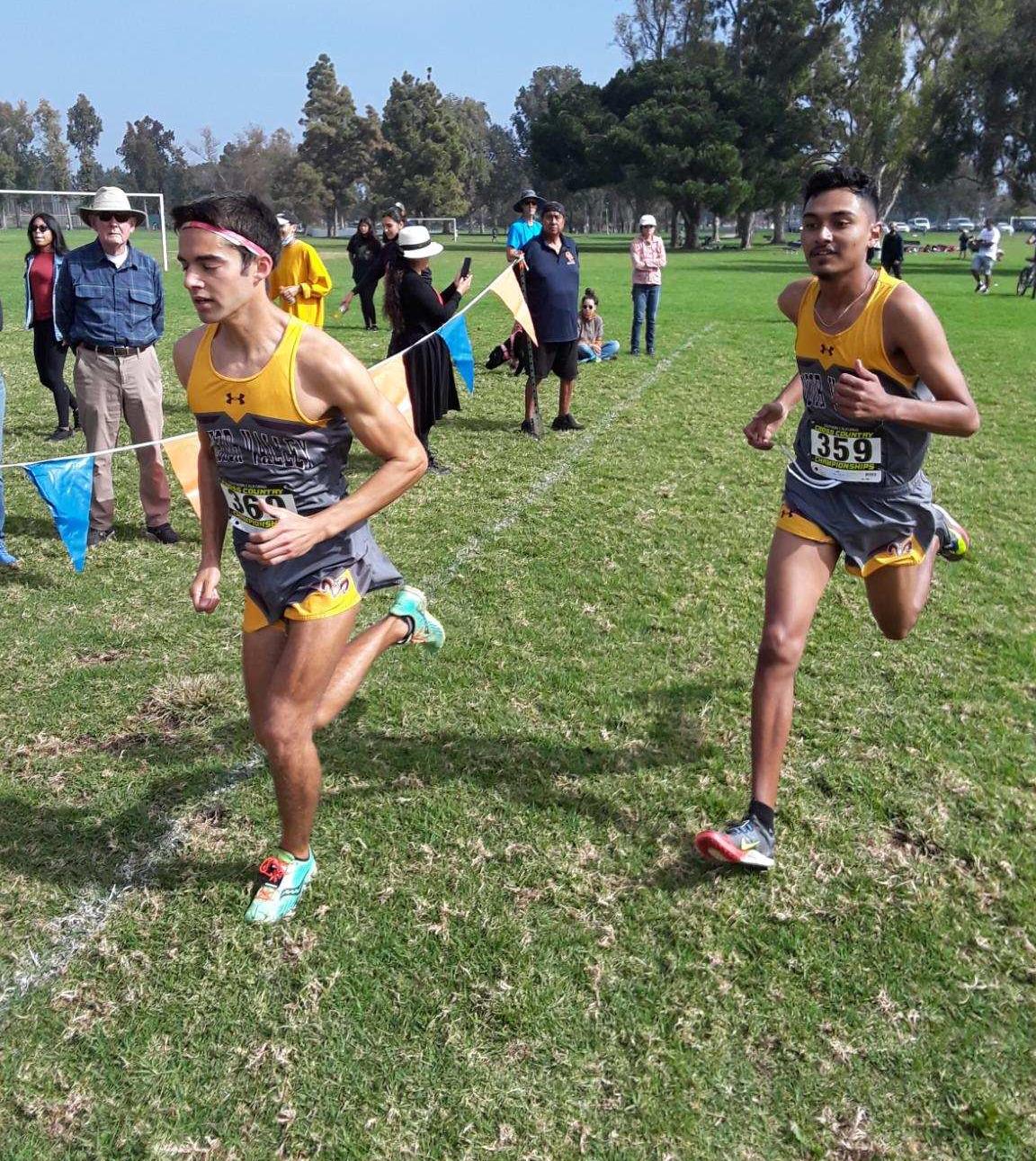 Eric Perez and Julian Gonzalez running at the Southern California Regional Cross Country Championship